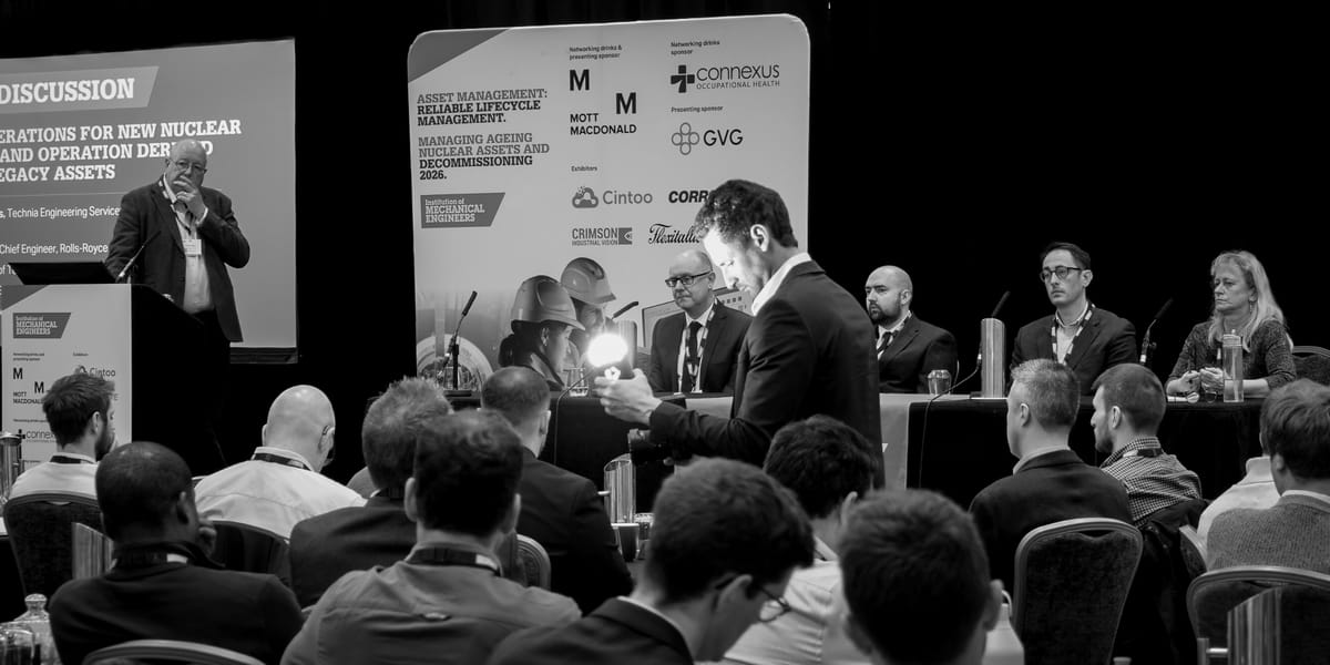 Black and white frame of a panel discussion at an Institution of Mechanical Engineers conference, filmed from the floor.